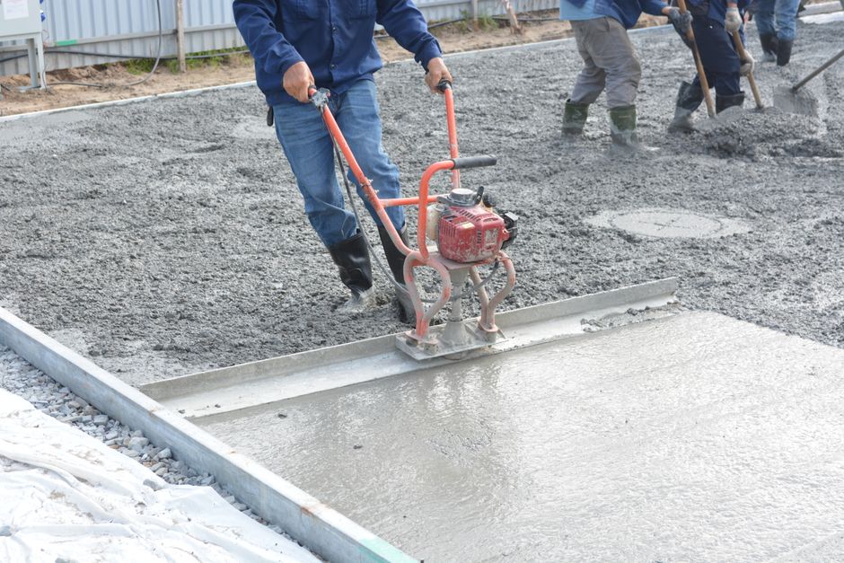 Concrete driveway pour at a construction site